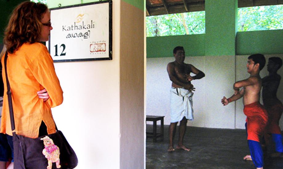 A tourist watching live training class at Kerala Kalamandalam