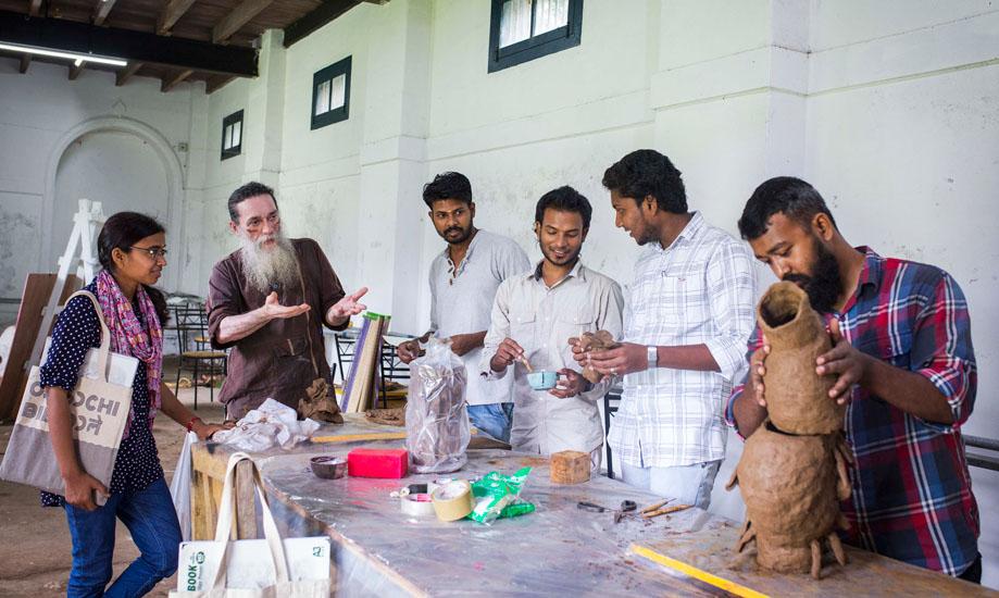 KMB- Artist Valsan Koorma Kolleri (second from left) giving directions to the participants